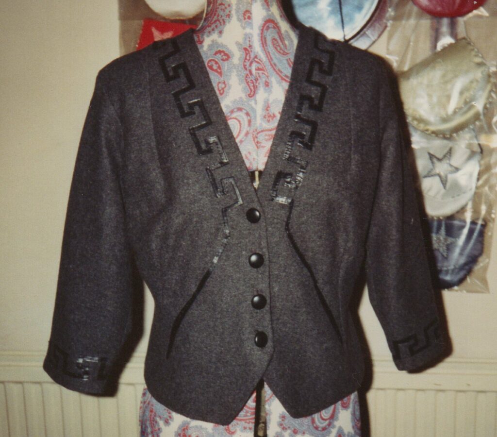 Commissioned silk lined wool jacket with hand sewn leather applique